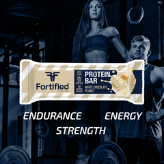 (White Chocolate Peanut) Protein bar packaging with two athletes in a gym setting, emphasizing 'Endurance', 'Energy', and 'Strength'.